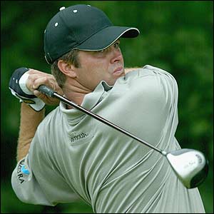 Robert Damron powerfully drives the ball