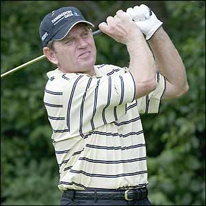 Zimbabwe's Nick Price watches his approach shot