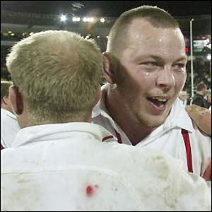 Neil Back and Steve Thompson celebrate