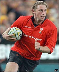 Jamie Robinson runs in to score Wales' only try of the match