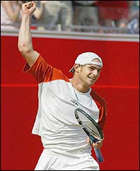 Roddick celebrates his epic win over Agassi