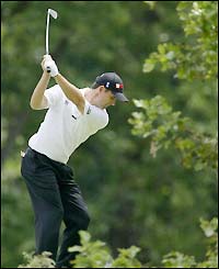 Harrington tees off at the fourth hole