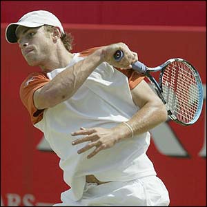Roddick powers a forehand over the net