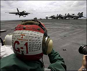 President Bush arrives aboard the USS Abraham Lincoln on a Viking jet