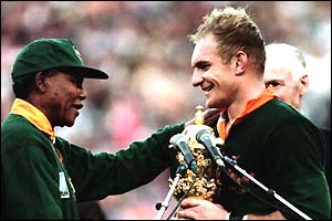 Nelson Mandela hands Springbok captain Francois Pienaar the World Cup