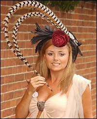 Tracey Dover wearing an extravagant feathered hat