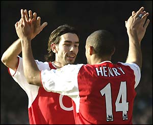 Robert Pires and Thierry Henry celebrate a goal in the 5-1 win over Man City