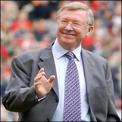 Sir Alex Ferguson smiles and waves to the crowd