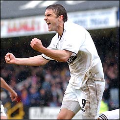 James Thomas celebrates after scoring his second penalty of the game.