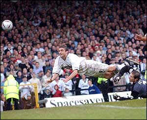 Swansea City's golden boy James Thomas floats through the air. 