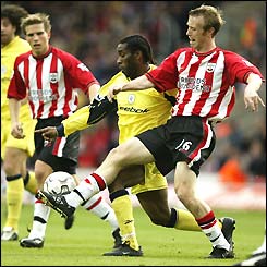 Jay-Jay Okocha tackles Southampton's Brett Ormerod
