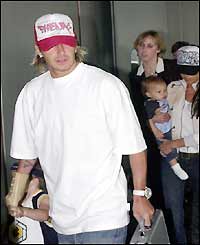 Beckham returns from a trip to the USA