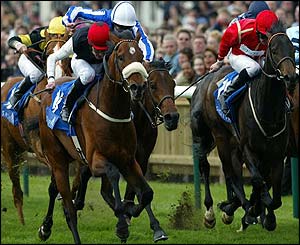 Refuse To Bend (left) edges into the lead in the 2,000 Guineas
