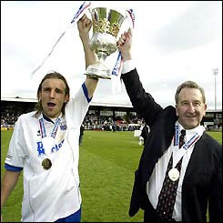 Rushden & Diamonds captain Paul Underwood holds the trophy with Chairman Max Griggs after winning Division Three title 
