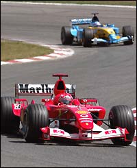 Alonso creeps up on leader Michael Schumacher 