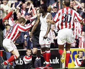 Ade Akinbiyi is worshipped by his team-mates as he keeps Stoke in Division One