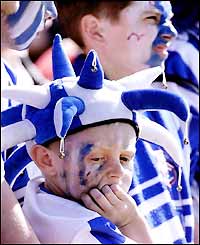 A young Brighton fan is disappointed to see his side relegated