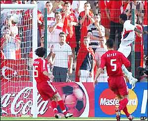 Damarcus Beasley jumps up to score the opener for the USA