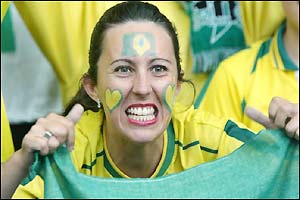 Brazil fans gear up for the match in their traditional colourful attire