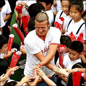 David Beckham is the centre of attention as he visits a school in Tokyo