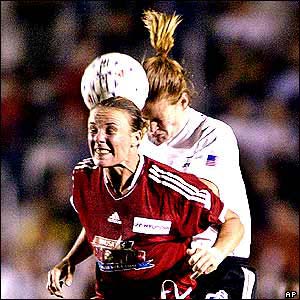Joanne Peters of the World All-Stars and American All-Stars' Cindy Parlow in action during the WUSA All-Star game 