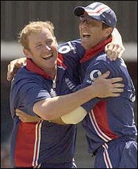 Anthony McGrath and Michael Vaughan celebrate McGrath's catch which ends the innings of Rashid Latif 