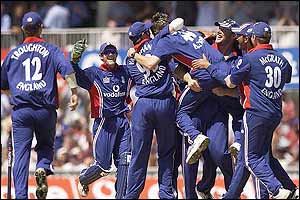 Anderson is lifted up by his team-mates as he completes his hat-trick