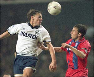 Spurs' Teddy Sheringham challenges Crystal Palace's Gareth Southgate in December 1994