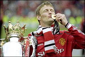 Teddy Sheringham celebrates with the Premiership trophy in May 1999
