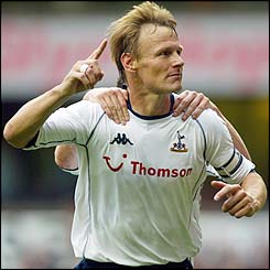 Sheringham celebrates scoring against West Ham in September 2002