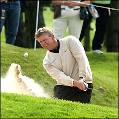 Colin Mongomerie gets his team mates out of the bunker