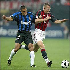 Inter's Ivan Cordoba struggles to keep up with AC Milan's Andriy Shevchenko 