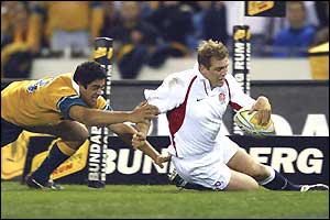 Mike Tindall, the England centre, scores England's second try