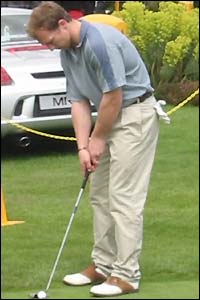 England scrum-half Matt Dawson practices his putting