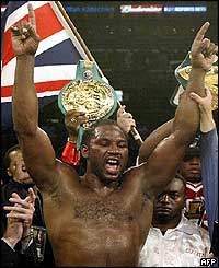 Lenox Lewis celebrates a far from convincing win over Vladimir Klitschko