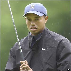 Tiger Woods braves the rain at the Buick Classic