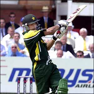 Imran Nazir mistimes a pull shot and is caught out by England captain Michael Vaughan