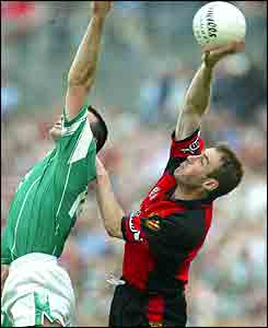  Fermanagh's Stephen Maguire and Down defender Brian Burns