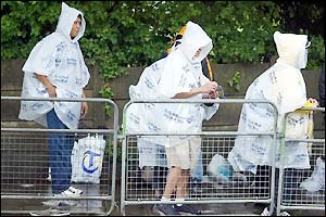 Fans queue in the rain on Monday morning