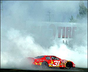 Robby Gordon spins doughnuts in his car after winning the Nascar Winston Cup Dodge Save Mart 350 at the Infineon Raceway on Sunday 