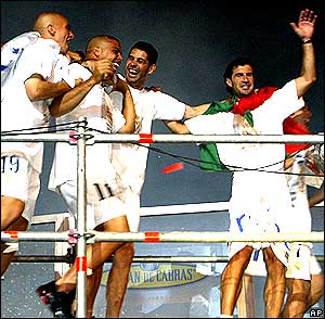 Real Madrid players (from left to right) Esteban Cambiasso, Ronaldo, Fernando Hierro and Luis Figo celebrate winning the Spanish title