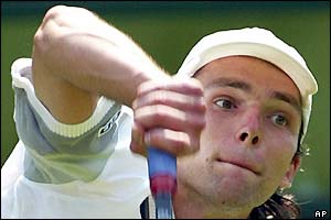 Croatia's Ivo Karlovic serves against Lleyton Hewitt