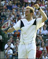 Greg Rusedski celebrates after beating Alexander Waske