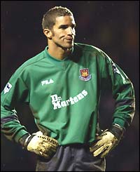 A gutted looking David James puts his hands on his hips