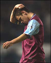 Joe Cole puts his hands on his head