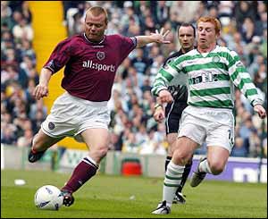 Hearts midfielder Phil Stamp is closely watched by Celtic's Neil Lennon