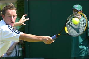 Richard Bloomfield plays a return against Anthony Dupuis