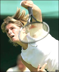 France's Emilie Loit serves
