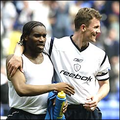 Jay Jay Okocha and Gudni Bergsson are all smiles as Bolton beat Man City 2-0 which leaves their fate in their own hands 