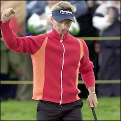 Johnson punches the air after his record round